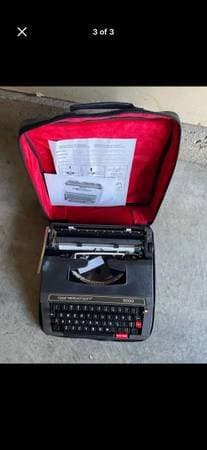 Portable typewriter, old school.