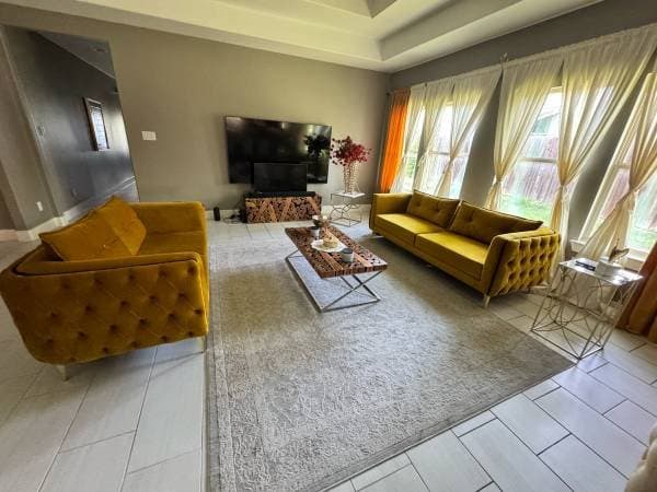 Living room, dining room, furniture, washer, and dryer