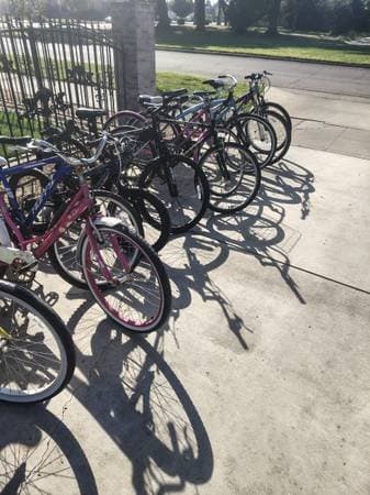 Big yard sale lots of good stuff bikes pants jackets and shorts for women and me